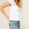 Jeans larghi a vita bassa con stampa a farfalla e lavaggio medio