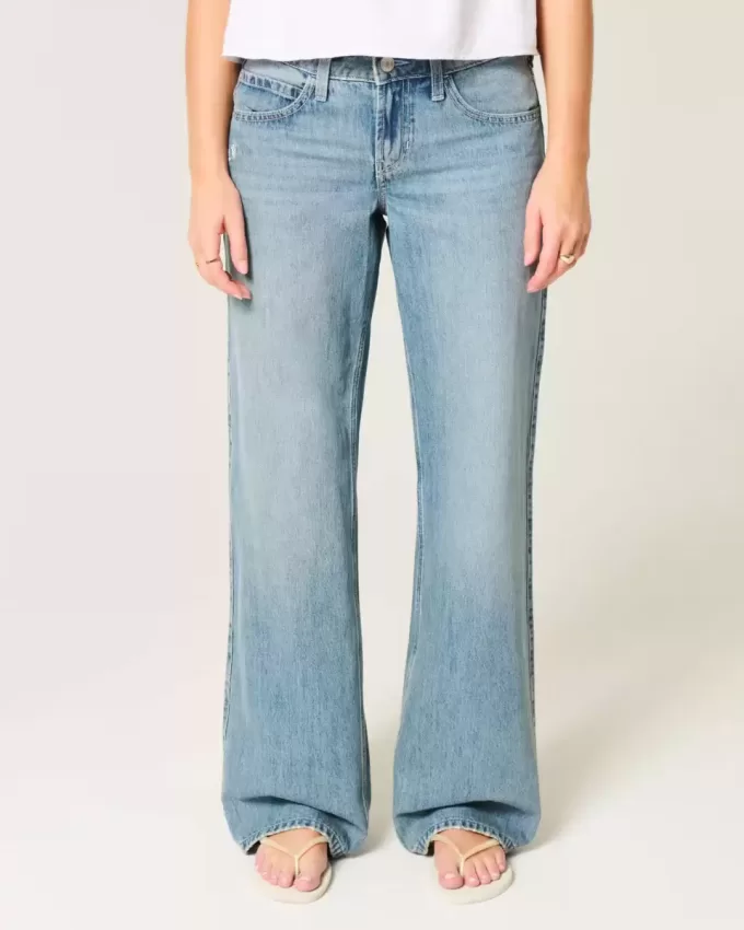 Jeans larghi a vita bassa con stampa a farfalla e lavaggio medio