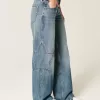 Jeans larghi a vita bassa con stampa a stelle e lavaggio medio