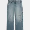Jeans larghi a vita bassa con stampa a stelle e lavaggio medio