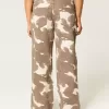Jeans larghi a vita bassa con stampa mucca