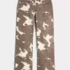 Jeans larghi a vita bassa con stampa mucca