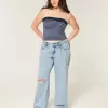 Jeans larghi a vita bassa con strappi e lavaggio chiaro