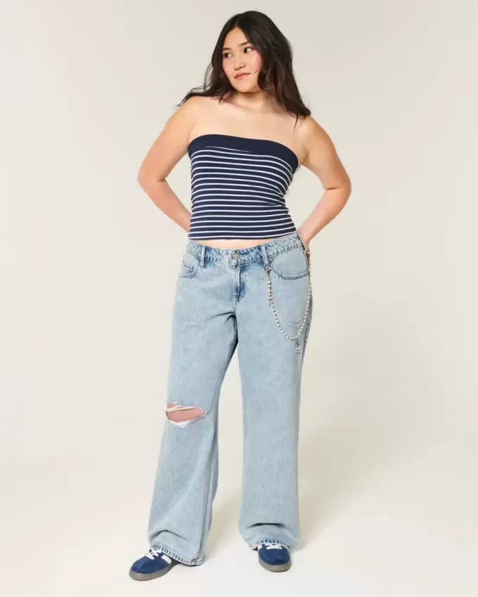 Jeans larghi a vita bassa con strappi e lavaggio chiaro