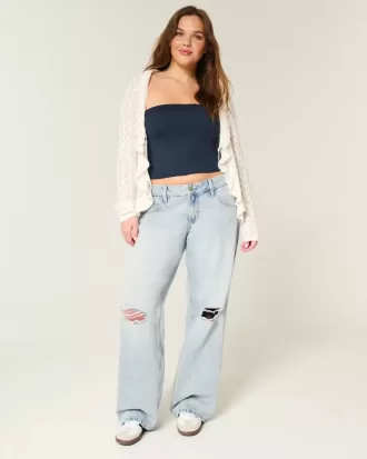 Jeans larghi a vita bassa con strappi e lavaggio chiaro