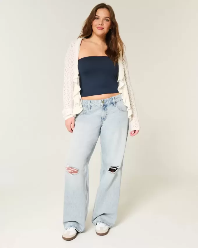Jeans larghi a vita bassa con strappi e lavaggio chiaro