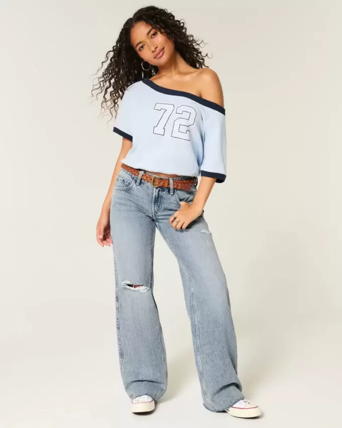Jeans larghi a vita bassa con strappi e lavaggio chiaro