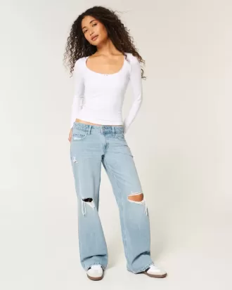 Jeans larghi a vita bassa con strappi e lavaggio chiaro