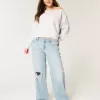 Jeans larghi a vita bassa con strappi e lavaggio chiaro