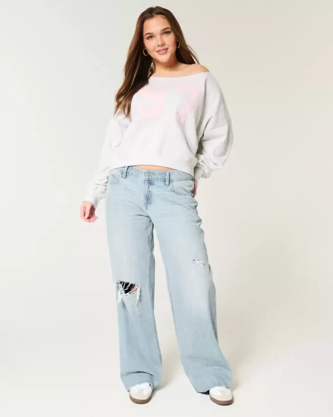 Jeans larghi a vita bassa con strappi e lavaggio chiaro