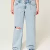 Jeans larghi a vita bassa con strappi e lavaggio chiaro