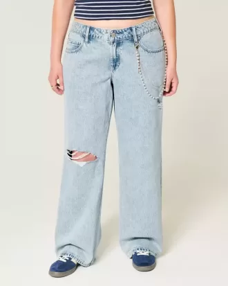 Jeans larghi a vita bassa con strappi e lavaggio chiaro