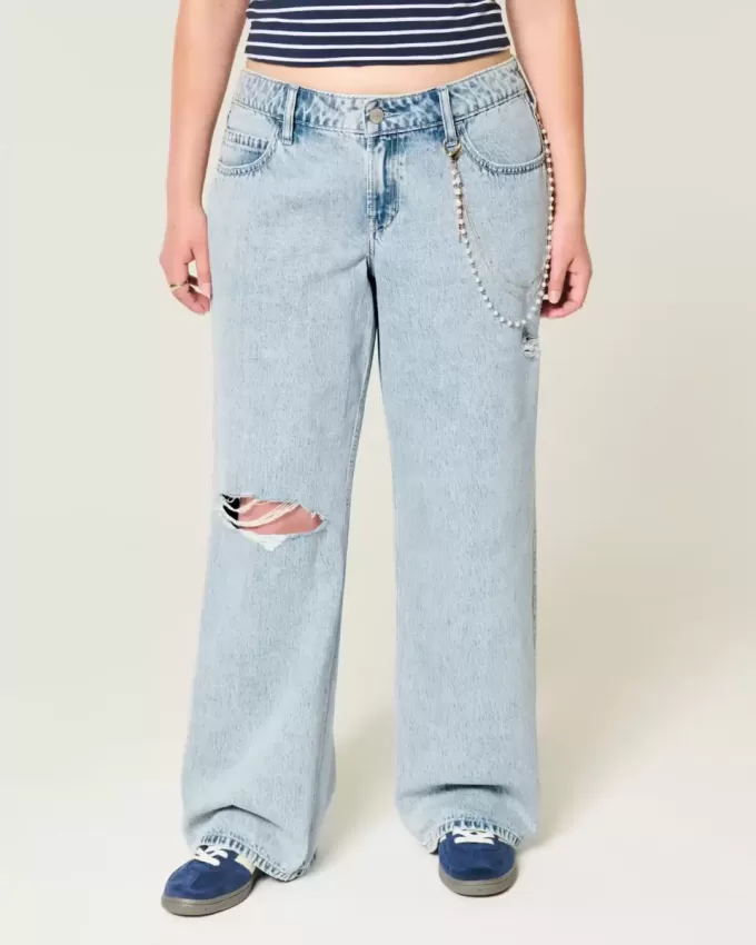Jeans larghi a vita bassa con strappi e lavaggio chiaro