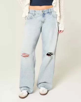 Jeans larghi a vita bassa con strappi e lavaggio chiaro