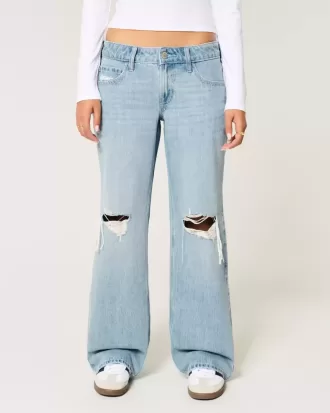 Jeans larghi a vita bassa con strappi e lavaggio chiaro
