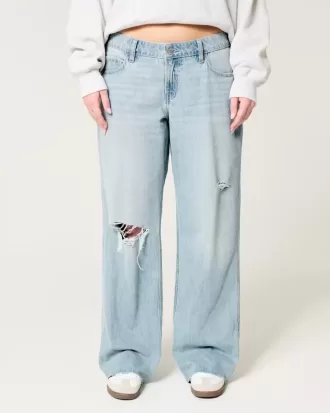 Jeans larghi a vita bassa con strappi e lavaggio chiaro