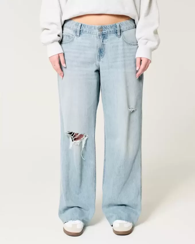 Jeans larghi a vita bassa con strappi e lavaggio chiaro