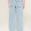 Jeans larghi a vita bassa con strappi e lavaggio chiaro