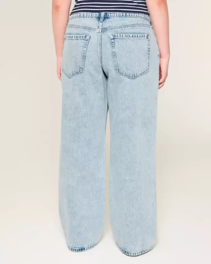 Jeans larghi a vita bassa con strappi e lavaggio chiaro