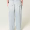 Jeans larghi a vita bassa con strappi e lavaggio chiaro