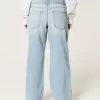 Jeans larghi a vita bassa con strappi e lavaggio chiaro