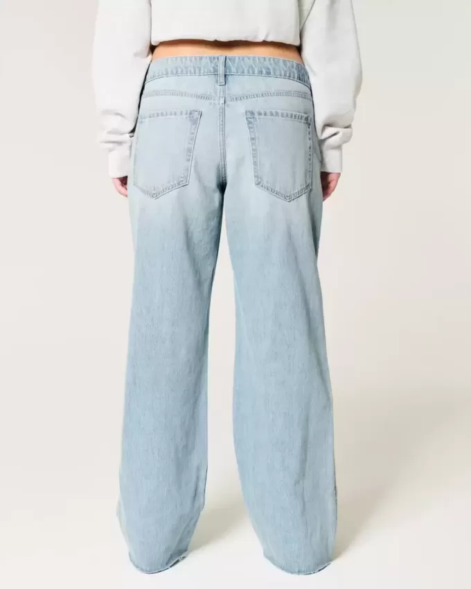 Jeans larghi a vita bassa con strappi e lavaggio chiaro
