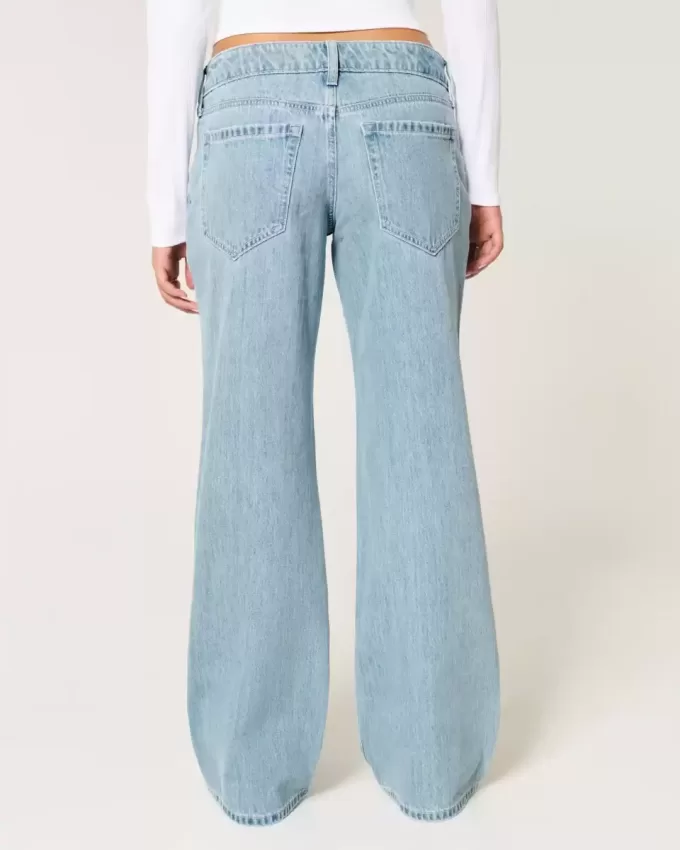 Jeans larghi a vita bassa con strappi e lavaggio chiaro