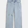 Jeans larghi a vita bassa con strappi e lavaggio chiaro