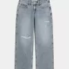 Jeans larghi a vita bassa con strappi e lavaggio chiaro