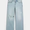 Jeans larghi a vita bassa con strappi e lavaggio chiaro