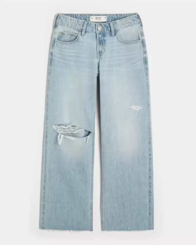 Jeans larghi a vita bassa con strappi e lavaggio chiaro