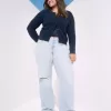 Jeans larghi a vita bassa con strappi e lavaggio chiaro