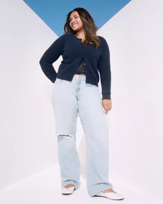 Jeans larghi a vita bassa con strappi e lavaggio chiaro