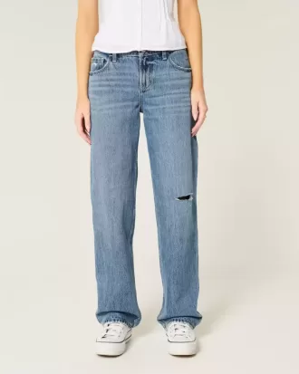 Jeans larghi a vita bassa con strappi e lavaggio medio