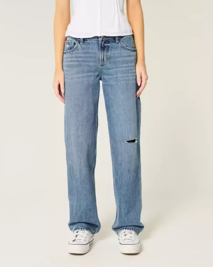 Jeans larghi a vita bassa con strappi e lavaggio medio