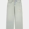 Jeans larghi a vita bassa e lavaggio chiaro effetto consumato