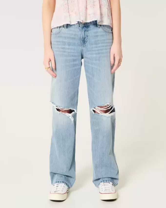 Jeans larghi a vita bassa e lavaggio chiaro strappati