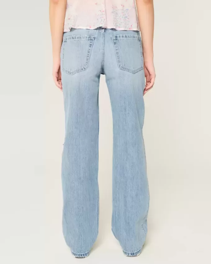Jeans larghi a vita bassa e lavaggio chiaro strappati