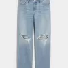 Jeans larghi a vita bassa e lavaggio chiaro strappati