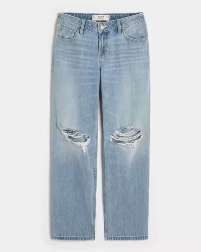 Jeans larghi a vita bassa e lavaggio chiaro strappati