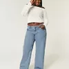 Jeans larghi a vita bassa e lavaggio medio con effetto curvy