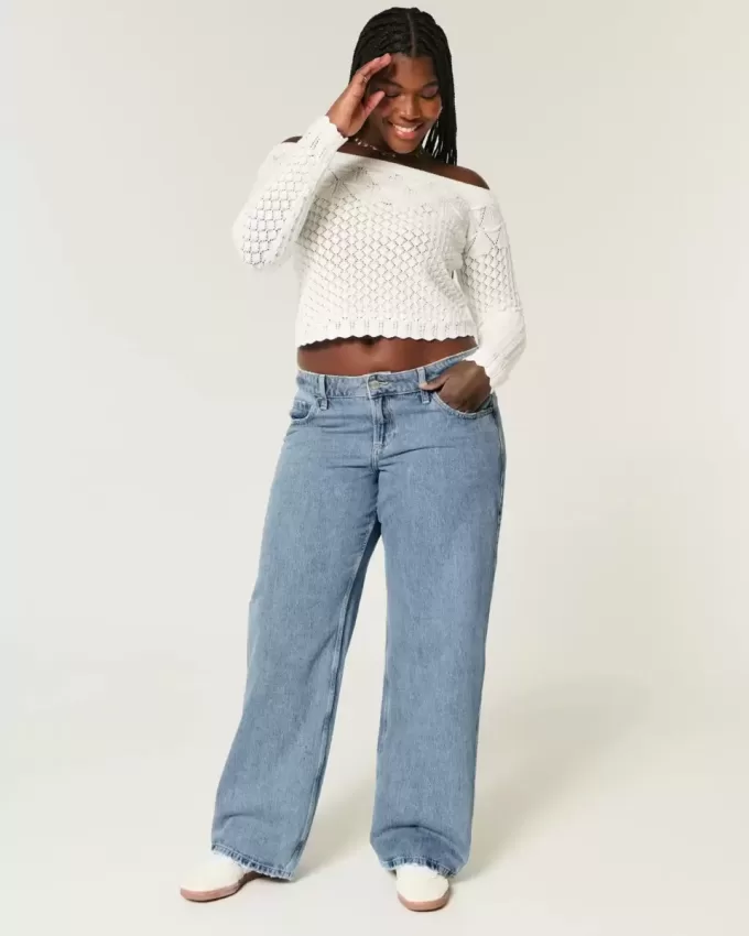 Jeans larghi a vita bassa e lavaggio medio con effetto curvy