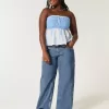 Jeans larghi a vita bassa e lavaggio medio con effetto curvy Jeans larghi a vita bassa e lavaggio medio con effetto curvy