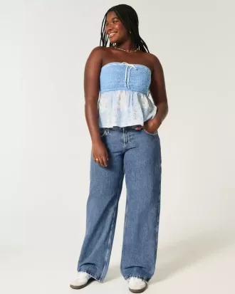Jeans larghi a vita bassa e lavaggio medio con effetto curvy