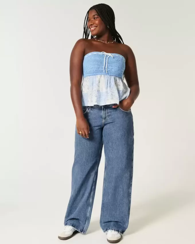 Jeans larghi a vita bassa e lavaggio medio con effetto curvy Jeans larghi a vita bassa e lavaggio medio con effetto curvy