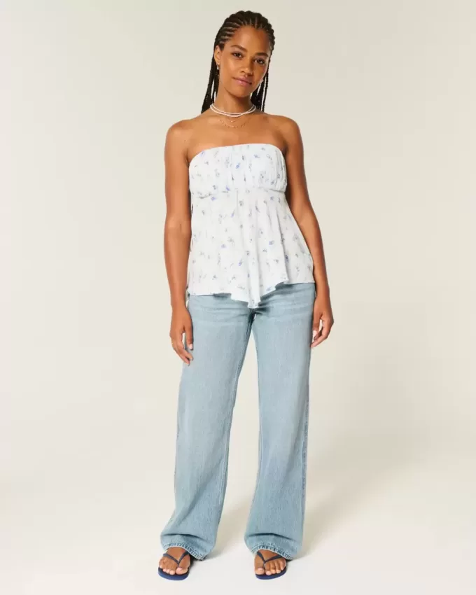 Jeans larghi a vita bassa e lavaggio medio con effetto curvy