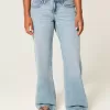 Jeans larghi a vita bassa e lavaggio medio con effetto curvy