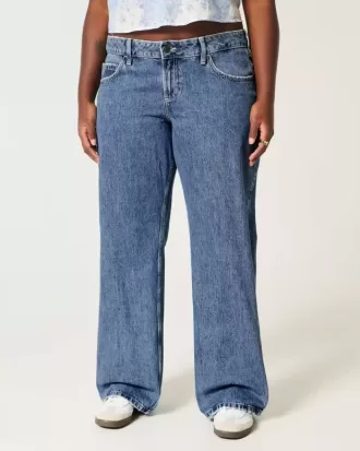Jeans larghi a vita bassa e lavaggio medio con effetto curvy