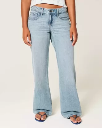 Jeans larghi a vita bassa e lavaggio medio con effetto curvy