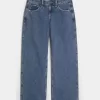 Jeans larghi a vita bassa e lavaggio medio con effetto curvy Jeans larghi a vita bassa e lavaggio medio con effetto curvy